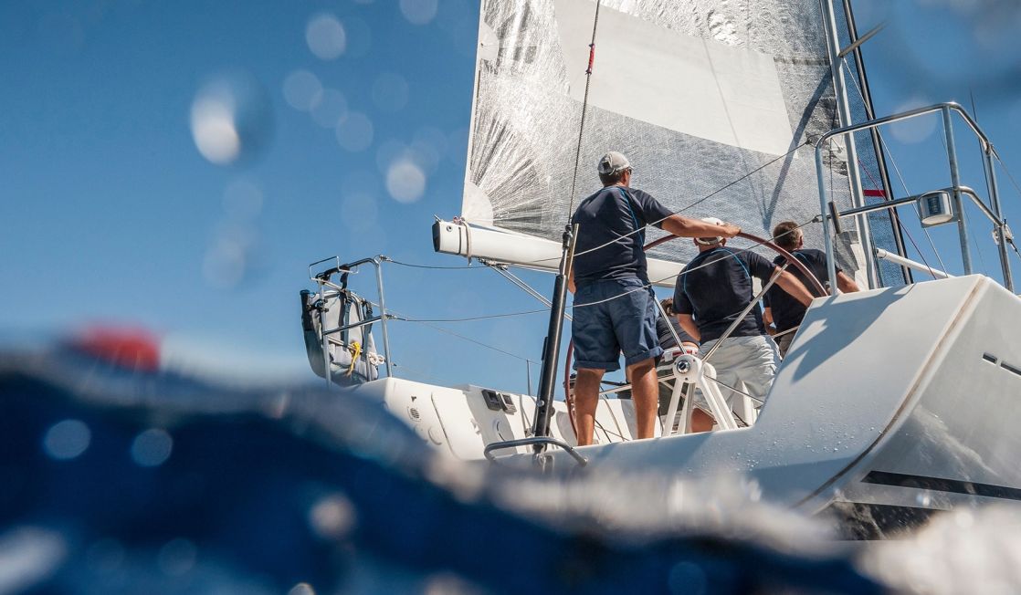 3 people operating a boat