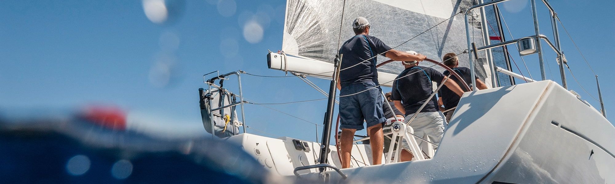 3 people operating a boat