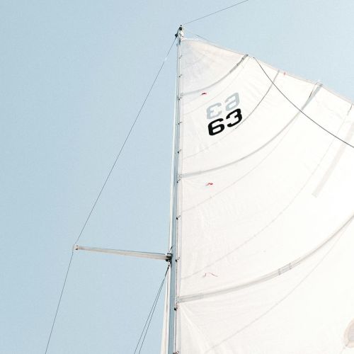 Photograph looking up towards a sail
