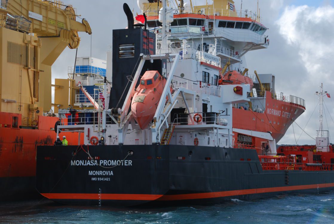 A ship docking to a bunkering vessel for refuelling