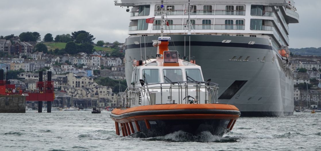 Pilot boat guiding a cruise liner