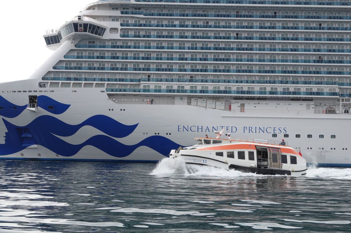 Small crew shuttle leaving a cruise liner