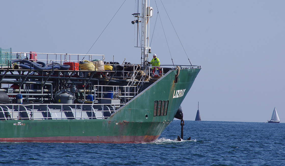 Bow of green commercial ship