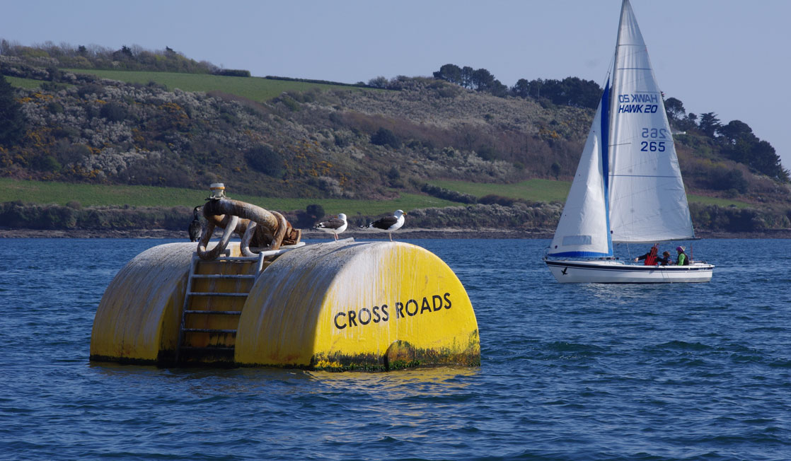 Crossroads buoy with boat in background