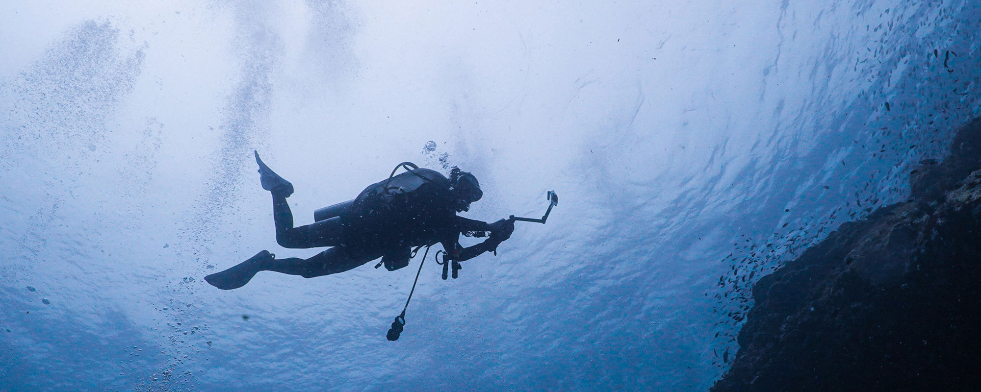 Diver underwater with camera