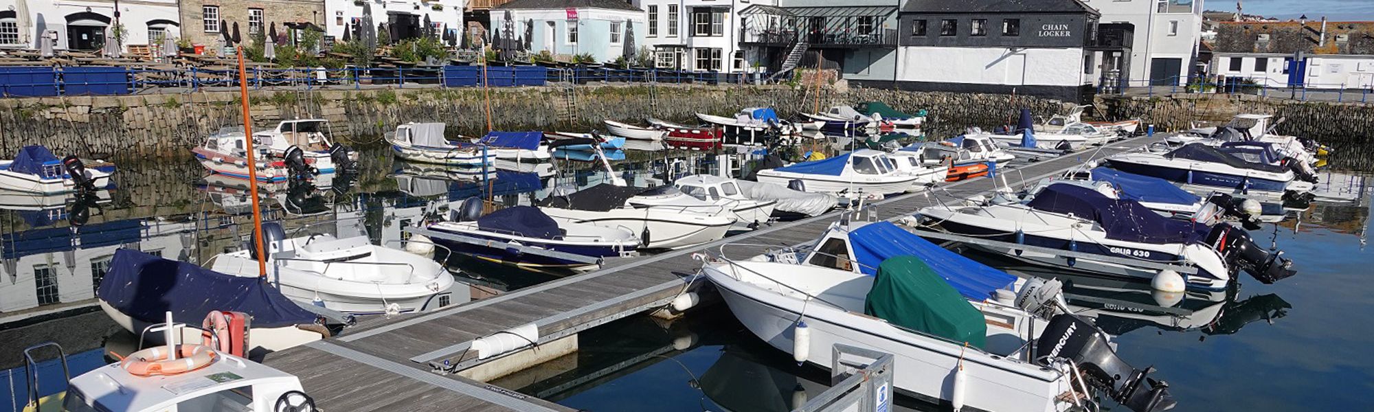 Small boats moored in harbour