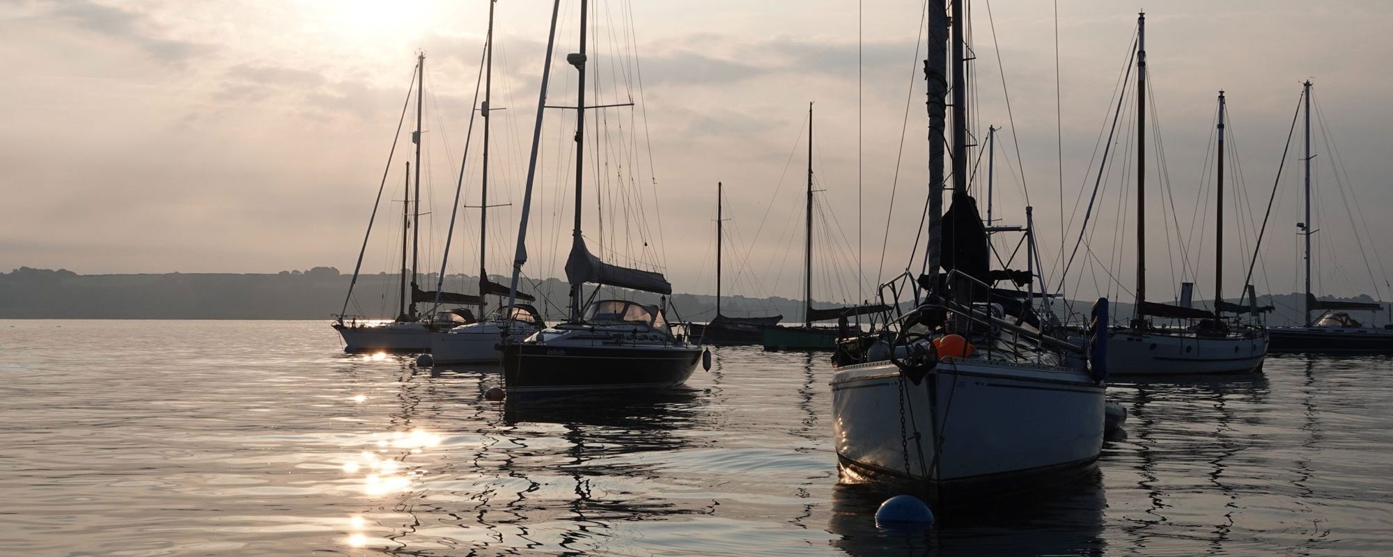 Boats moored in the early morning light