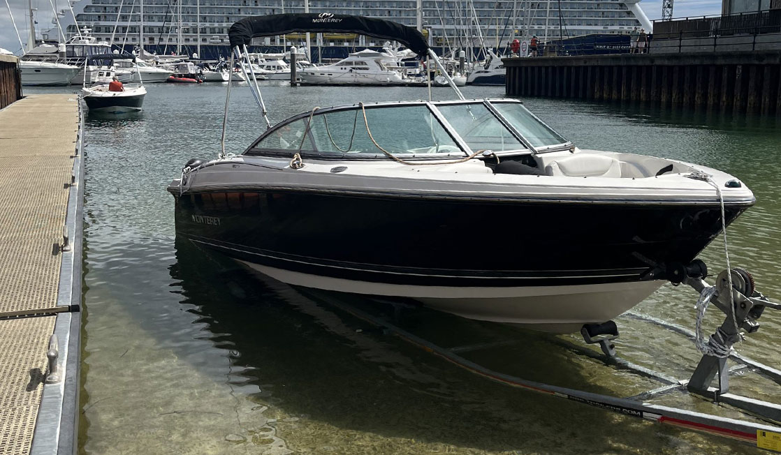 A small boat waiting to be launched from the Falmouth Harbour slipway