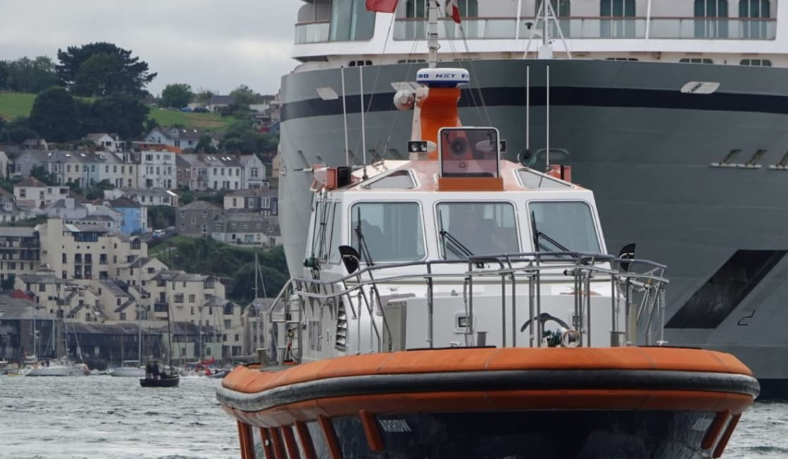 Pilot Boat guiding a cruise ship in the Falmouth Harbour